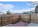 Private backyard featuring a brick patio and wooden fence, creating a serene outdoor space at 1100 S Waco St # G, Aurora, CO 80017
