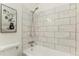 Stylish bathroom features updated tile shower with sleek fixtures and modern art on the walls at 1100 S Waco St # G, Aurora, CO 80017