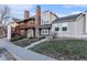 Attractive townhouse with a brick chimney, a small front yard and a cozy second story porch at 1100 S Waco St # G, Aurora, CO 80017