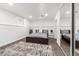 Finished basement bedroom with a bed, rug, and mirrored closet at 7475 W Kentucky Ave, Lakewood, CO 80226
