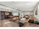 Finished basement with pool table and large sectional sofa at 7475 W Kentucky Ave, Lakewood, CO 80226