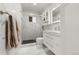 Modern bathroom with marble finishes and a walk-in shower at 7475 W Kentucky Ave, Lakewood, CO 80226