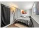 Cozy basement bedroom with a double bed and calming decor at 7475 W Kentucky Ave, Lakewood, CO 80226