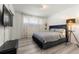 Comfortable bedroom with large bed and plenty of natural light at 7475 W Kentucky Ave, Lakewood, CO 80226