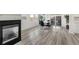 Bright dining area with fireplace and patio access at 7475 W Kentucky Ave, Lakewood, CO 80226