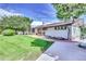 Side view of the house, highlighting the backyard and landscaping at 7475 W Kentucky Ave, Lakewood, CO 80226