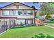 House exterior showcasing a well-maintained lawn and landscaping at 7475 W Kentucky Ave, Lakewood, CO 80226