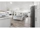 Open concept kitchen with a large island and modern appliances at 7475 W Kentucky Ave, Lakewood, CO 80226