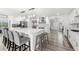 Modern kitchen featuring white cabinetry and a spacious island at 7475 W Kentucky Ave, Lakewood, CO 80226