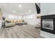 Spacious living room featuring a cozy fireplace and ample seating at 7475 W Kentucky Ave, Lakewood, CO 80226