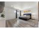 Spacious main bedroom with large bed and great natural light at 7475 W Kentucky Ave, Lakewood, CO 80226