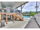 Private inground pool with wooden deck and stairs at 7475 W Kentucky Ave, Lakewood, CO 80226
