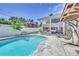 Relaxing pool area with ample deck space and patio furniture at 7475 W Kentucky Ave, Lakewood, CO 80226