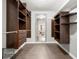 Large walk-in closet with ample shelving and hanging space at 7475 W Kentucky Ave, Lakewood, CO 80226
