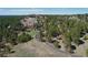 View of a modern style home on a large lot with mature trees at 1559 Apex Rd, Franktown, CO 80116