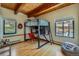 Bright bedroom featuring a lofted bed with a built in desk and lots of light at 1559 Apex Rd, Franktown, CO 80116