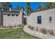 Modern home with a manicured lawn and walkway leading to a sleek, black front door at 1559 Apex Rd, Franktown, CO 80116