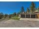 Three car attached garage with spacious driveway at 1559 Apex Rd, Franktown, CO 80116