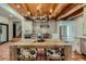 Open kitchen featuring a dining table, stainless steel refrigerator and modern white countertops at 1559 Apex Rd, Franktown, CO 80116