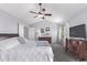 Spacious main bedroom featuring a vaulted ceiling, ceiling fan, and a large window at 10345 Lions Heart, Lone Tree, CO 80124