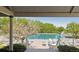 A view of the community pool framed by lush trees, a perfect place to relax and enjoy the outdoors at 10345 Lions Heart, Lone Tree, CO 80124