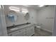 Bright bathroom features dual sinks, granite countertop, modern lighting, and a neutral color palette at 100 E Highline Cir # 307, Centennial, CO 80122