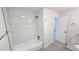 Bright bathroom with white subway tiles, granite countertop, and wood-look flooring at 100 E Highline Cir # 307, Centennial, CO 80122