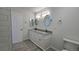 Bright bathroom features dual sinks, granite countertop, modern lighting, and a neutral color palette at 100 E Highline Cir # 307, Centennial, CO 80122