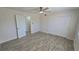 Bedroom with ceiling fan, closet, and ensuite bathroom at 100 E Highline Cir # 307, Centennial, CO 80122