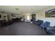 Spacious community room featuring a kitchenette, lounge area, fireplace, and dining area at 100 E Highline Cir # 307, Centennial, CO 80122