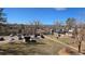 Exterior view showcasing landscaping, parking, and community buildings at 100 E Highline Cir # 307, Centennial, CO 80122