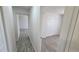 Hallway view featuring updated flooring and closet at 100 E Highline Cir # 307, Centennial, CO 80122