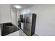 Bright kitchen with stainless steel refrigerator and appliances with stone countertops at 100 E Highline Cir # 307, Centennial, CO 80122