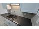 Modern kitchen with sleek countertops, stainless steel appliances, and white cabinetry at 100 E Highline Cir # 307, Centennial, CO 80122
