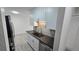 Modern kitchen with sleek countertops, stainless steel appliances, and white cabinetry at 100 E Highline Cir # 307, Centennial, CO 80122