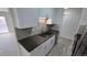 Modern kitchen with sleek countertops, stainless steel appliances, and white cabinetry at 100 E Highline Cir # 307, Centennial, CO 80122