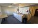 Bright laundry room featuring multiple washers, dryers, folding table, and utility sink at 100 E Highline Cir # 307, Centennial, CO 80122