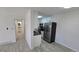 Open concept living space showcases the kitchen with stainless steel refrigerator and modern cabinets at 100 E Highline Cir # 307, Centennial, CO 80122
