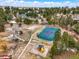 An aerial view of a home that features a tennis court and a playground at 1330 Conifer Pl, Elizabeth, CO 80107