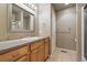 Bathroom featuring wood cabinetry, laminate counters, and tile flooring at 1330 Conifer Pl, Elizabeth, CO 80107