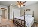 Cozy bedroom with traditional furnishings, including a wooden bed frame and a ceiling fan at 1330 Conifer Pl, Elizabeth, CO 80107