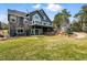 A two story home with a walkout basement surrounded by green grass and trees at 1330 Conifer Pl, Elizabeth, CO 80107