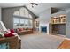 Cozy living room with fireplace, built-in shelves, and comfortable seating at 1330 Conifer Pl, Elizabeth, CO 80107