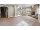 Open living room with stone fireplace, plush carpeting, neutral paint, and natural light at 1330 Conifer Pl, Elizabeth, CO 80107