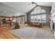 Bright living room featuring high ceilings, large windows, and an open floor plan at 1330 Conifer Pl, Elizabeth, CO 80107