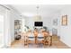 Spacious open floor plan integrates living, dining, and entertaining spaces, enhanced by hardwood flooring at 9542 Cherry St, Thornton, CO 80229