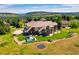 Sprawling estate featuring a pool, trampoline, and a large, beautifully landscaped backyard at 13 Tamarade Dr, Littleton, CO 80127