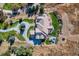 Stunning aerial view of a home featuring a curved driveway and immaculately manicured grounds at 13 Tamarade Dr, Littleton, CO 80127