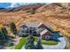 Impressive aerial view of a luxurious home showcasing its sprawling layout and meticulously landscaped grounds at 13 Tamarade Dr, Littleton, CO 80127