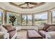 Cozy sitting area with large windows providing natural light and views of the surrounding landscape at 13 Tamarade Dr, Littleton, CO 80127